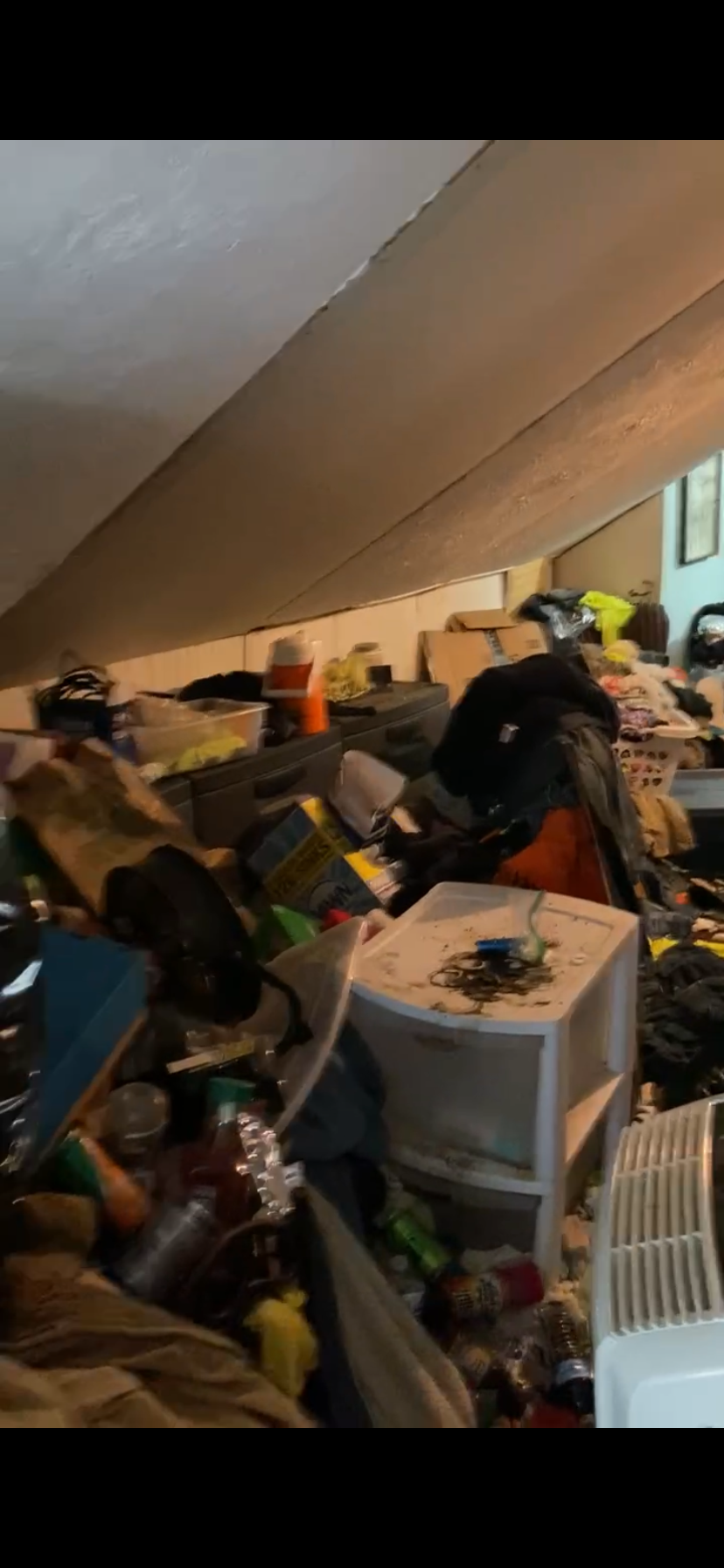 Cluttered room before cleaning
